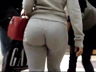 Candid redhead girl big bubble ass in grey pants at store