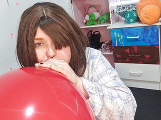 Girl Blowing up 3 huge balloons